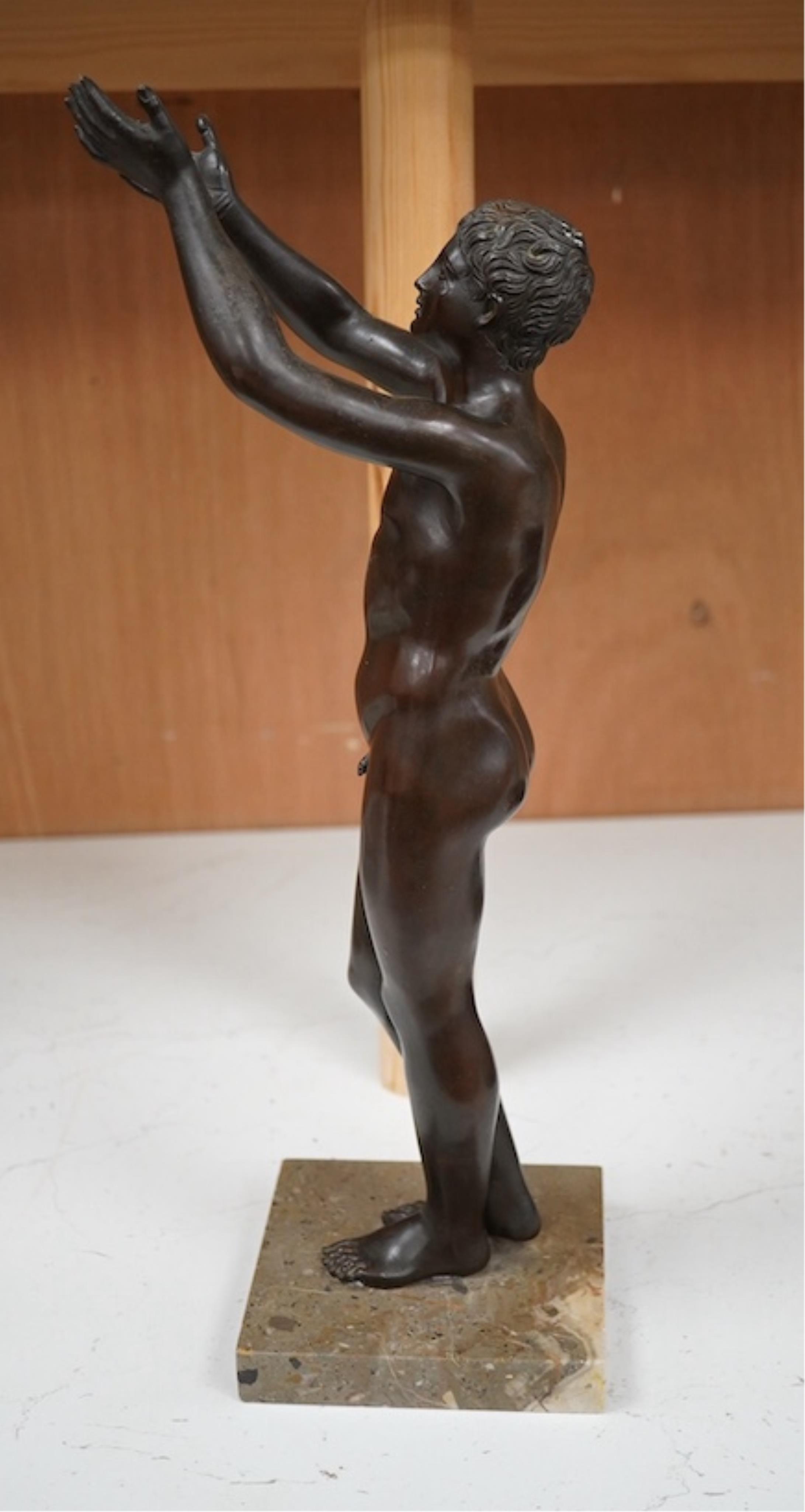 A patinated bronze figure, after the antique ‘The Praying Boy’. 42cm high. Condition - good